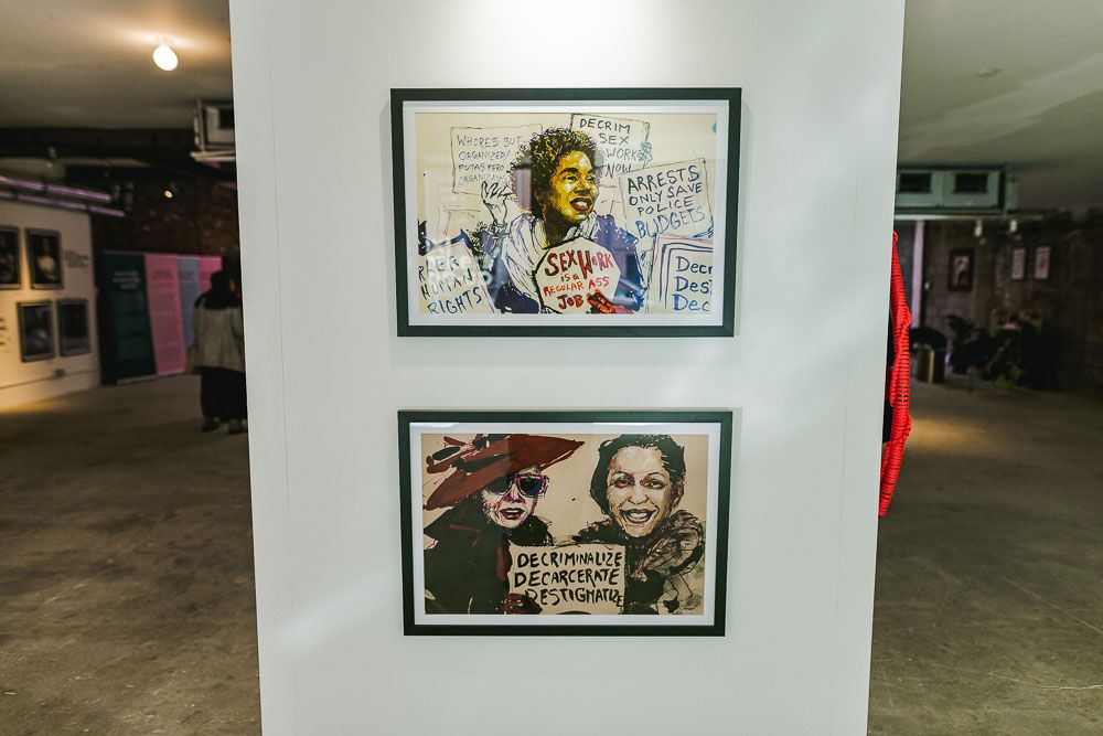 A photo of two works by Molly Crabapple at the Sex Workers' Pop-Up.